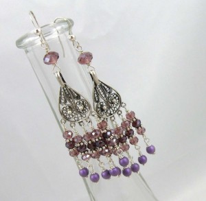 Silver filigree chandelier earrings with pink, purple, and fuchsia Swarvoski cyrstals.