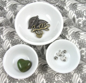 metal and ceramic beads in bowls