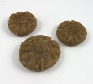 Polymer clay beads tinted with ground cloves.