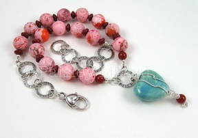 Pink and turquoise necklace designed by Paisley Lizard