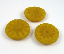 Polymer clay beads tinted with tumeric powder.