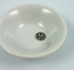 silver bead cap in bowl