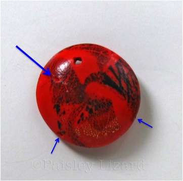 Picture of polymer clay bead with misplaced hole