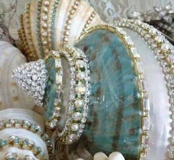 seashells painted and wrapped with beads