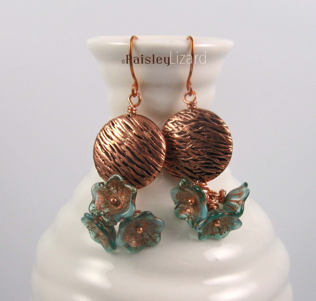 Lichen Blossom earrings on bottle