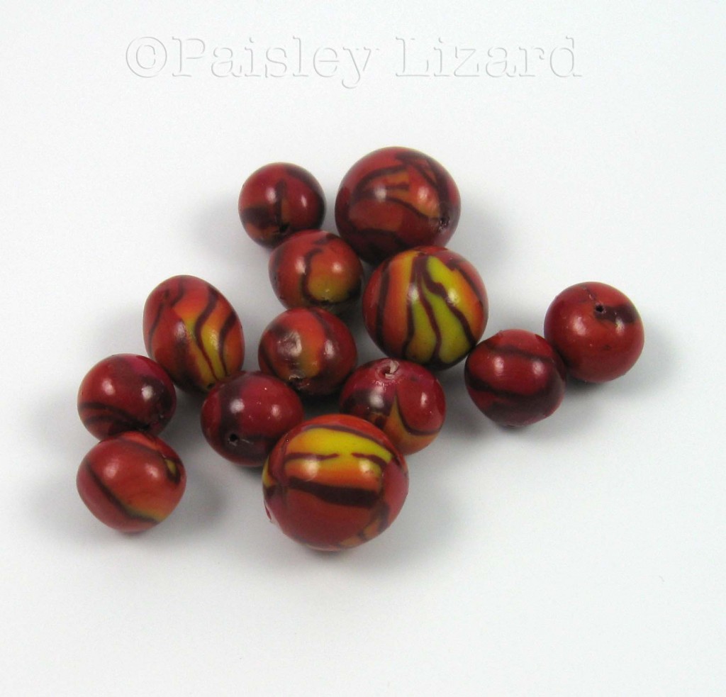 Polymer clay beads with leaf cane pattern