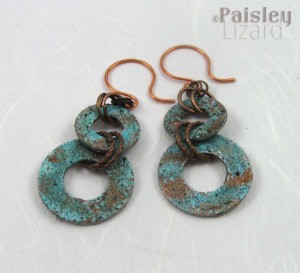 Patina washer earrings on white background