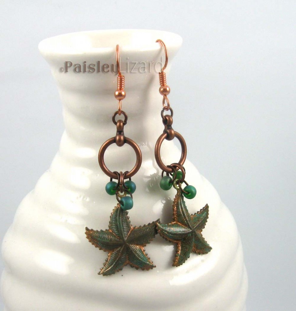 Large stafish dangle earrings on bottle