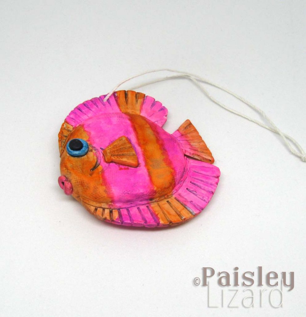 vivid pink and orange tang fish