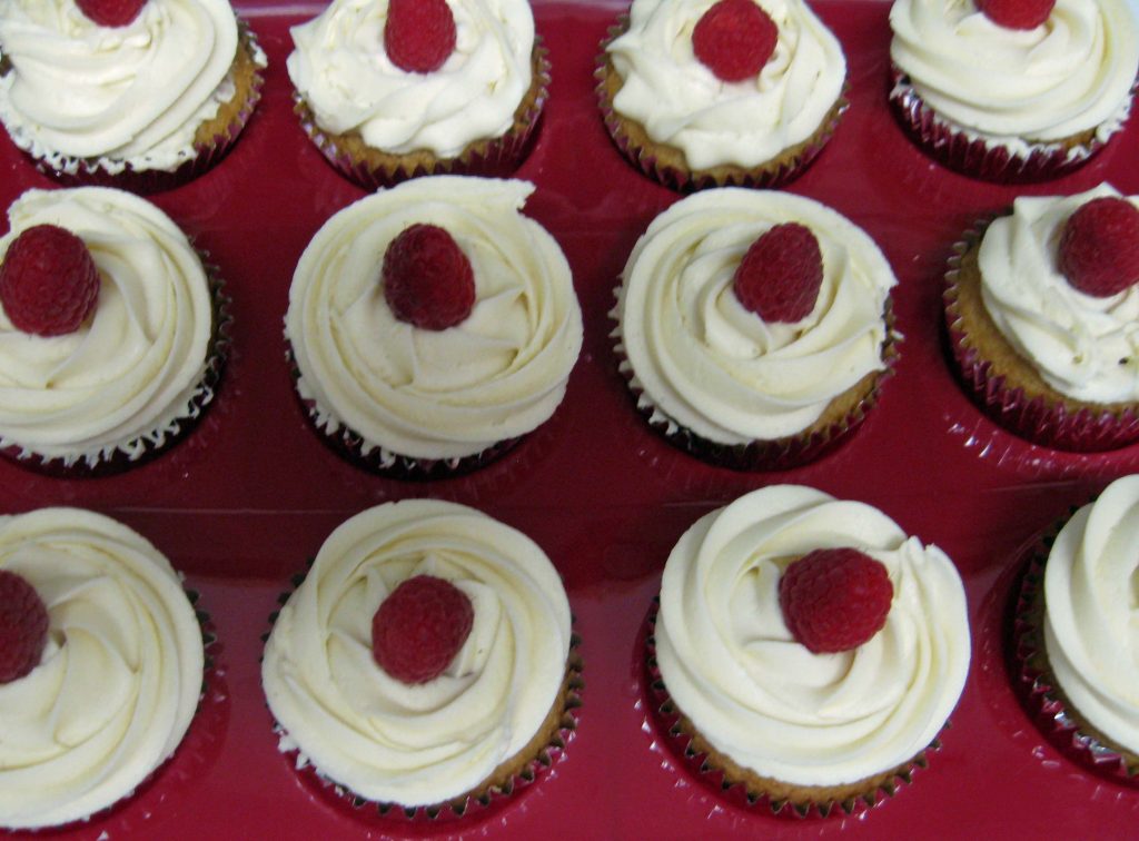 red velvet cupcakes with white chocolate ganache frosting