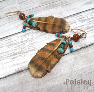 Boho earrings with polymer clay red-tailed hawk feathers