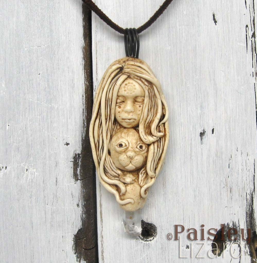 Selkie goddess necklace on whitewash wood background