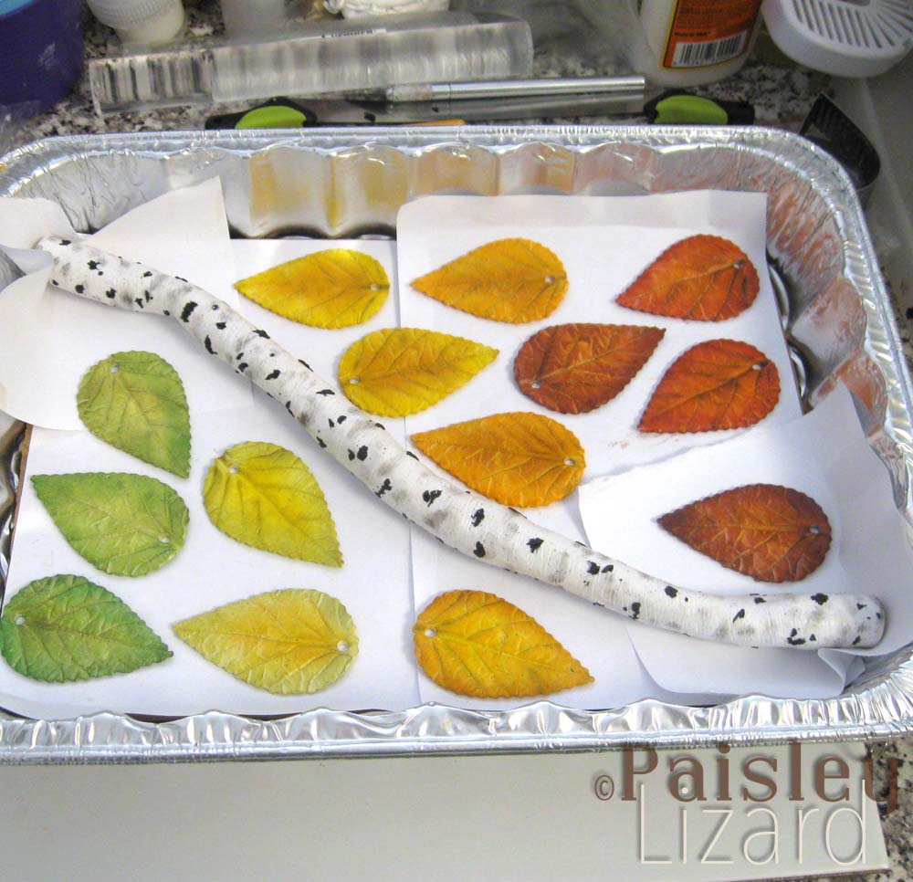 Polymer clay birch branch and fall leaves in baking pan