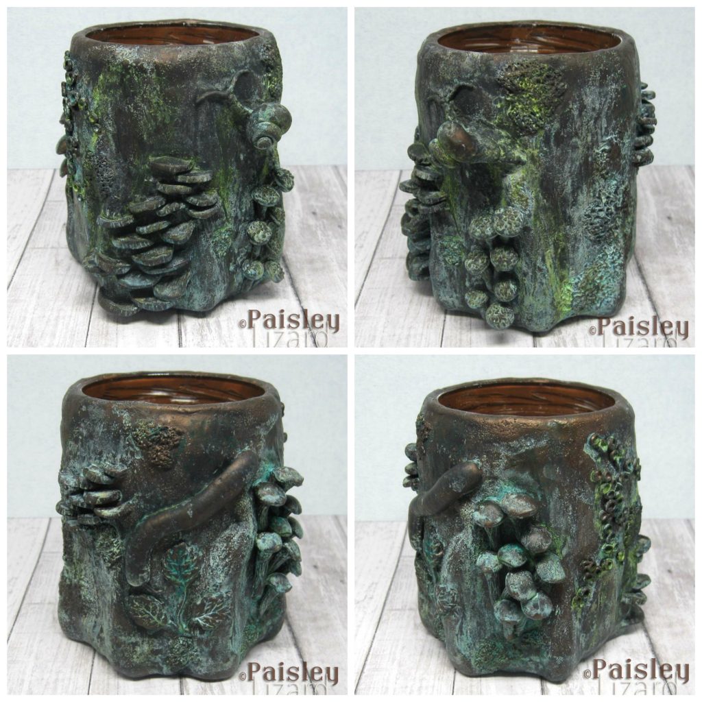 Tree stump themed sculpture with bronze patina