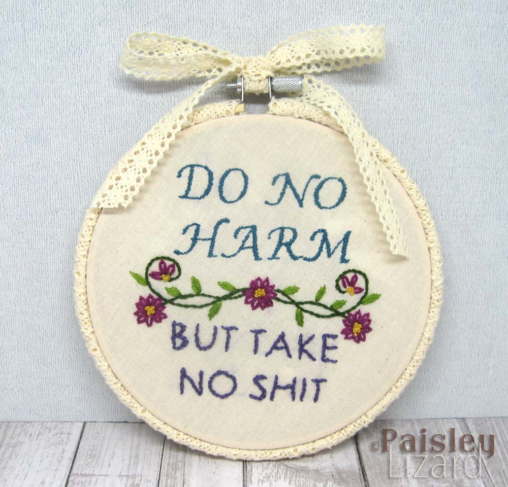 Modern embroidery hoop with Do no harm phrase