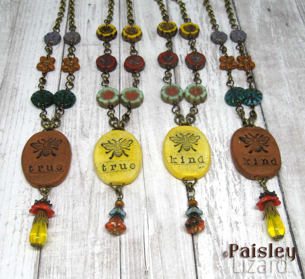 Collection of boho necklaces with bee pendants