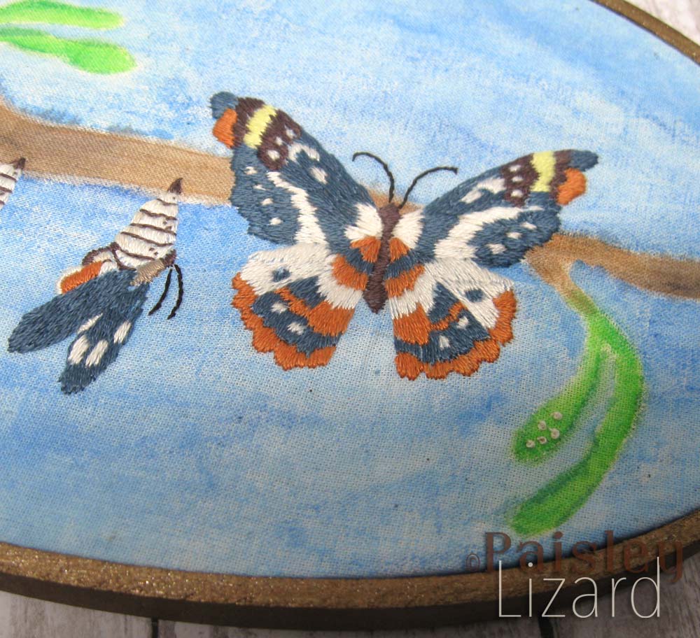 Thread painted butterfly on painted fabric