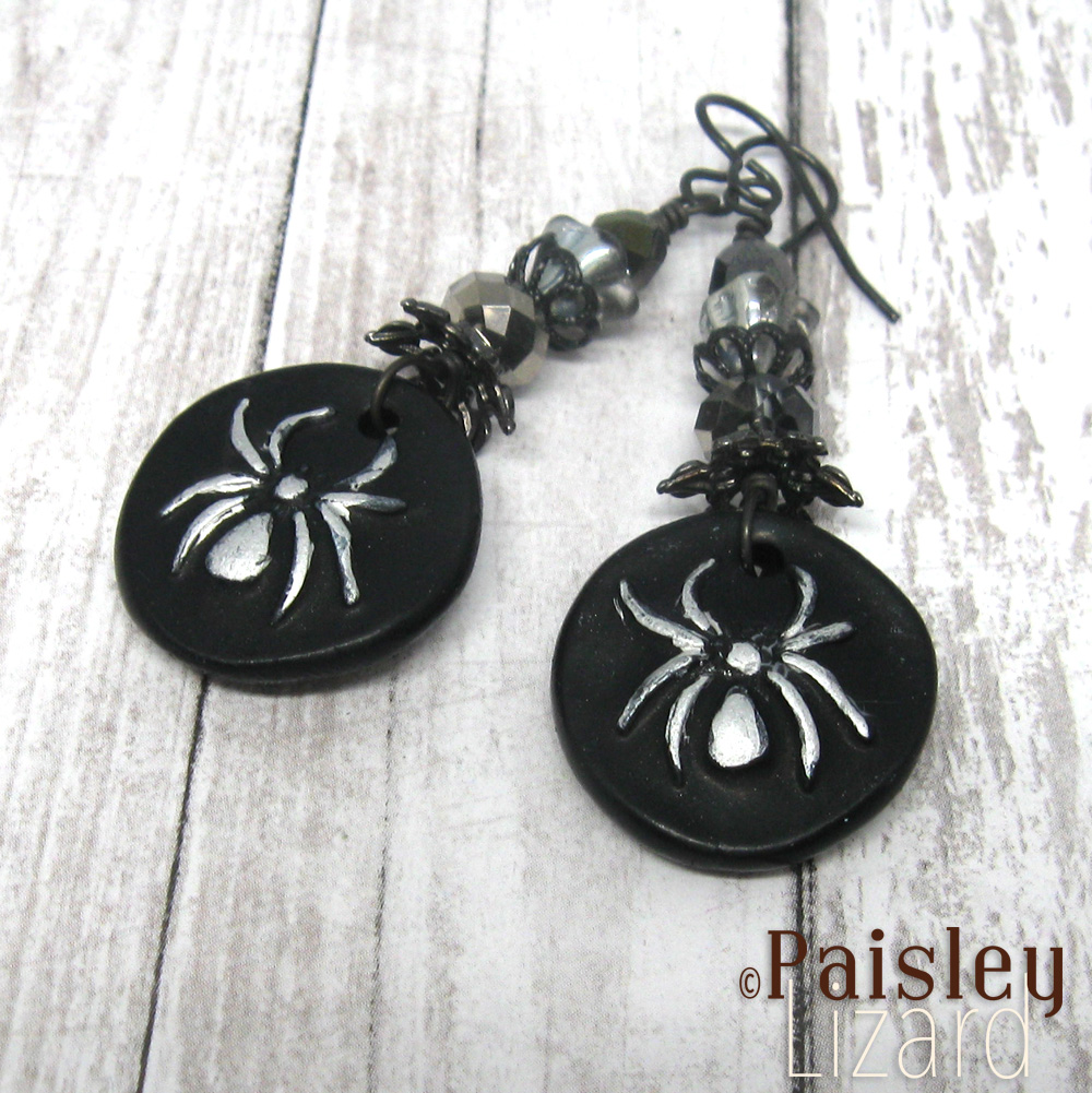 Black dangle earrings with spider charms
