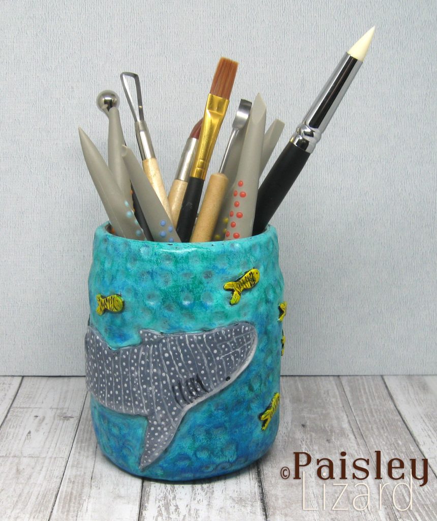 Whale shark upcycled glass jar filled with clay sculpting tools.